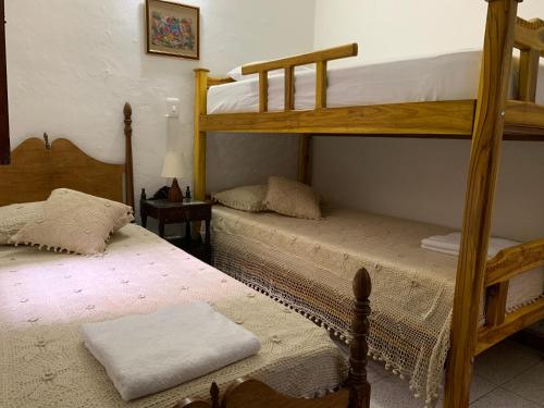 a bedroom with two bunk beds in a room at Casa Grande in Medellín