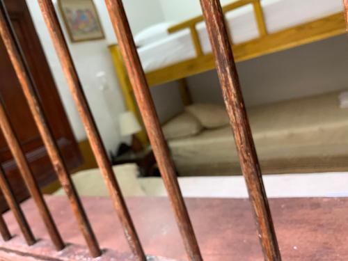 a staircase with wooden railings in a room at Casa Grande in Medellín