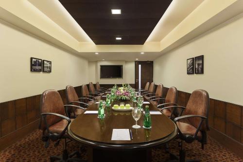 a conference room with a long table and chairs at Park Plaza, Ludhiana in Ludhiana