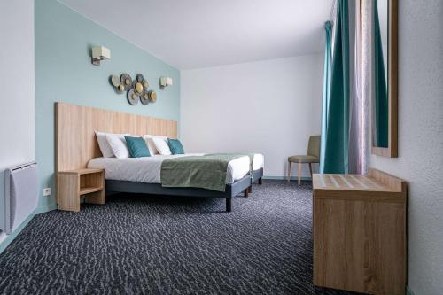 a bedroom with a bed and a green curtain at Les Hameaux De Lozere Sure Hotel Collection by Best Western in Fournels
