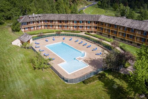 an aerial view of a hotel with a swimming pool at Les Hameaux De Lozere Sure Hotel Collection by Best Western in Fournels