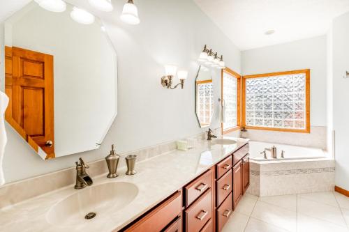 a bathroom with two sinks and a large mirror at Everview in Waynesville