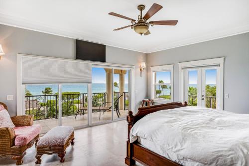 a bedroom with a bed and views of the ocean at Casa Koto in Islamorada