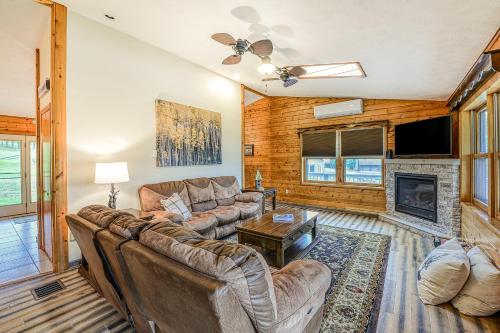 a living room with a couch and a fireplace at Gleanings Pond in McHenry