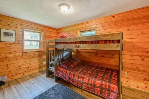 a bedroom with two bunk beds in a cabin at Gleanings Pond in McHenry