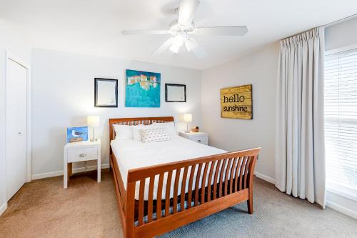 a bedroom with a bed and a ceiling fan at Bayou Village 610 in Destin