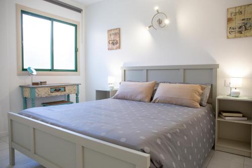 Postel nebo postele na pokoji v ubytování Casa Tiago with High-speed Wifi and Smarttv