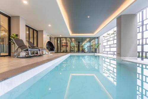 a swimming pool in a house at 56 Hotel in Bangna