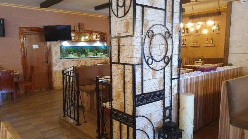 a room with a bar with a stained glass wall at Sea Horse in Burgas City