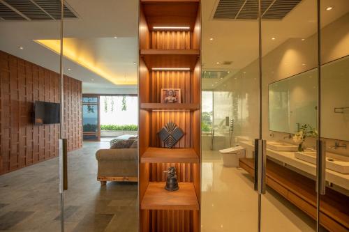 a bathroom with a toilet and a sink at Rachawadee Surin Beach-SHA Extra Plus in Surin Beach