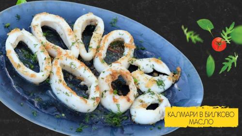 a plate of calamari rings on a blue plate at Family Hotel Kedara in Burgas City