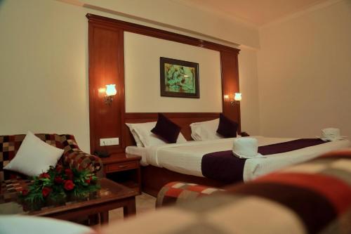 Ένα ή περισσότερα κρεβάτια σε δωμάτιο στο Hotel Edassery Mansion
