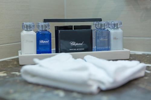 a group of blue and white bottles on a counter at Hotel St.Gotthard in Zürich