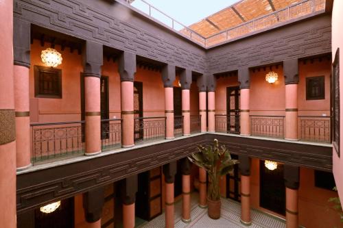 arium of a building with columns and a ceiling at Riad Sultan Suleiman in Marrakech
