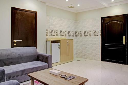 a living room with a couch and a coffee table at Al Tamayoz Al Raqi - Bani Malik in Jeddah