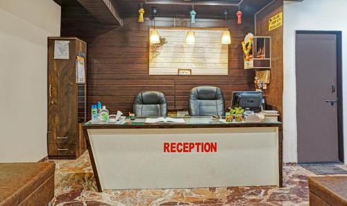 a reception desk in a room with a registration sign at Itsy By Treebo - Punest in Pune
