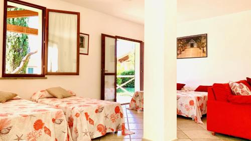 Postel nebo postele na pokoji v ubytování Casa in Maremma Tuscany Village