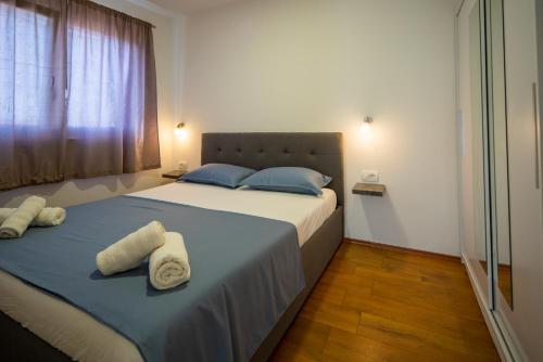 Postel nebo postele na pokoji v ubytování Apartman Antea 1