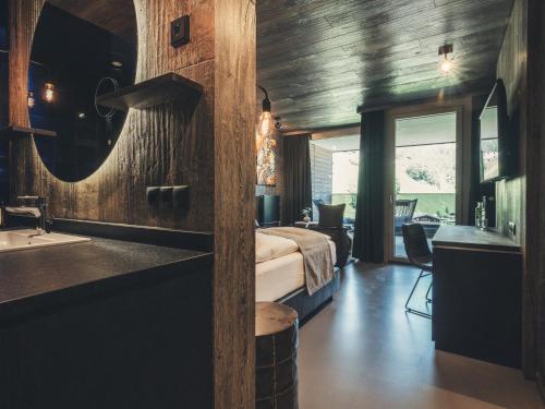 Katil atau katil-katil dalam bilik di Hotel Tirolerhof 4 Sterne Superior