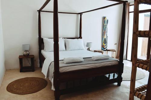 Un pat sau paturi într-o cameră la Boutique Lux Villa