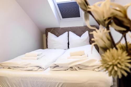 Un pat sau paturi într-o cameră la Smart Resorts Rubin 107