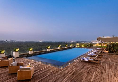 a large swimming pool on top of a building at Vivanta Bhubaneswar DN Square in Bhubaneshwar