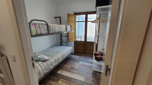 A bed or beds in a room at Ca La Fustereta