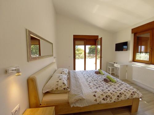 Postel nebo postele na pokoji v ubytování Villa Markulin, Šišan