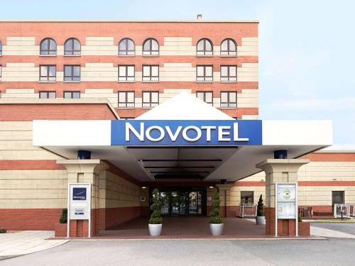 a large building with a sign on the side of it at Novotel Southampton in Southampton
