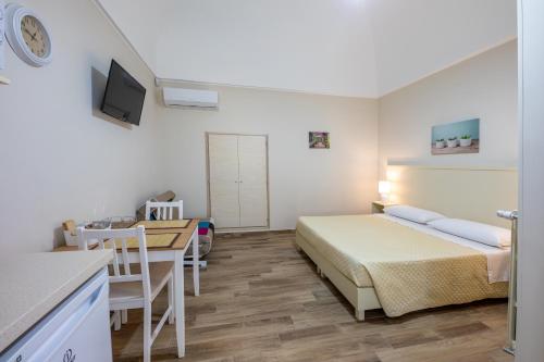 Кровать или кровати в номере Agriturismo Dea Cerere