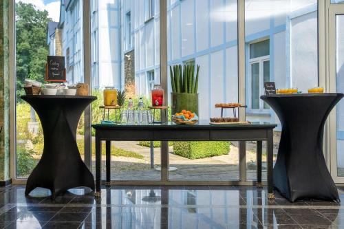 a table with food on it in front of a building at Radisson BLU Balmoral in Spa