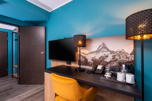 Μια τηλεόραση ή/και κέντρο ψυχαγωγίας στο Mercure Hotel München Neuperlach Süd