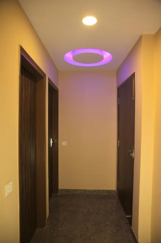 a hallway with a purple light on a ceiling at CASA CENTRAL in New Delhi