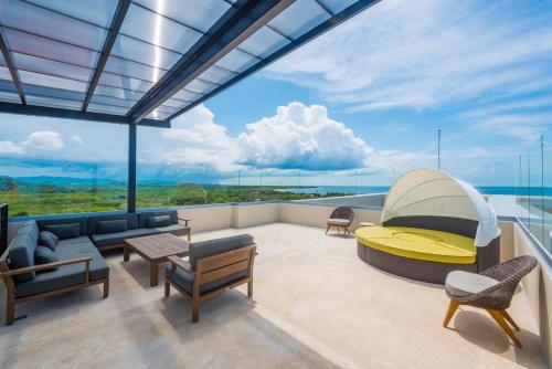 a living room with a view of the ocean at Brandnew Luxury 2Bdr condo✰Stunning view✰Fast wifi in Tamarindo