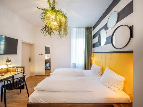 Postel nebo postele na pokoji v ubytování acor Boutique Hotel