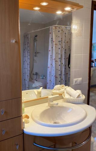 a bathroom with a sink and a shower and a tub at Casa Zawadi in Mijas