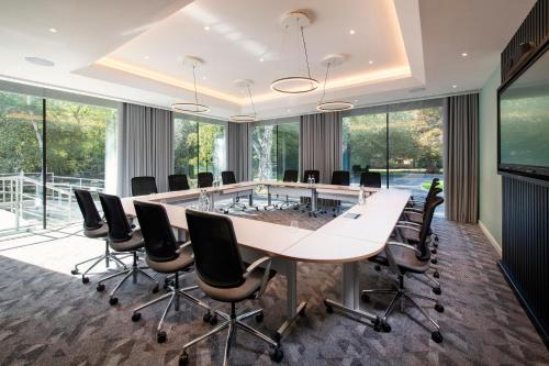 an office meeting room with a large table and chairs at Holiday Inn London-Shepperton by IHG in Shepperton