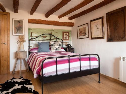a bedroom with a large bed in a room at Casa Cosialls in Benabarre