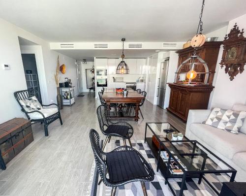 a living room with a couch and a table at Atico Bremadito in Torrox Costa