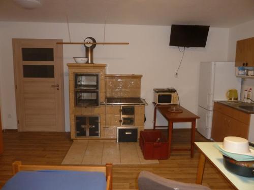 TV a/nebo společenská místnost v ubytování Apartmán menší