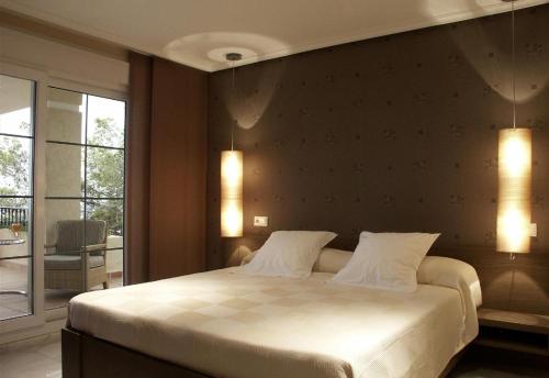 Postel nebo postele na pokoji v ubytování Ducado Real