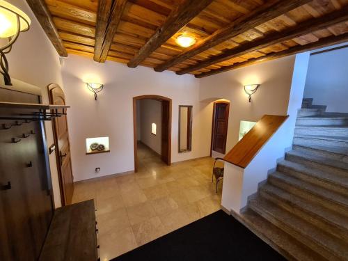 an image of a hallway with stairs in a house at Statek Kopanina in Kopanina
