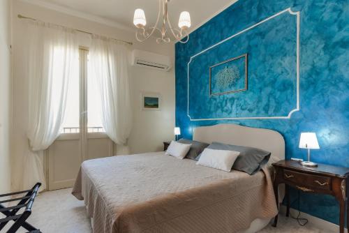 A bed or beds in a room at Alghero Roof Garden