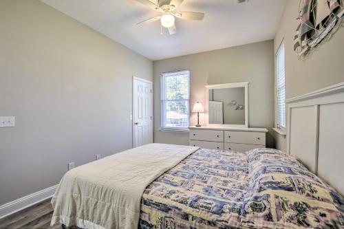 a bedroom with a bed and a ceiling fan at Murrells Inlet Home Half-Mi to Marsh Walk! in Myrtle Beach