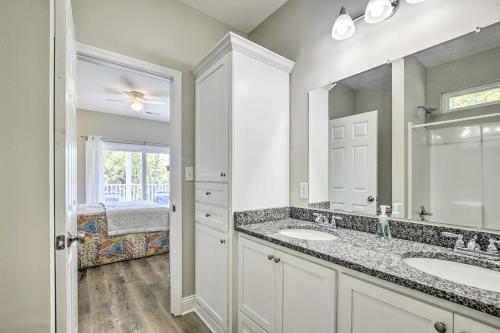 a bathroom with two sinks and a large mirror at Murrells Inlet Home Half-Mi to Marsh Walk! in Myrtle Beach