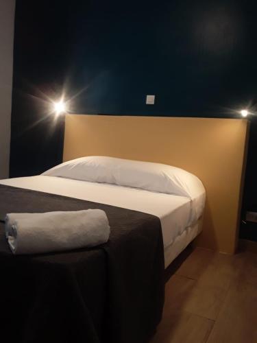 Postel nebo postele na pokoji v ubytování Hôtel Résidence De Bruxelles