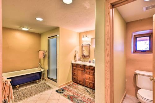 a bathroom with a tub and a sink and a toilet at Luxe Twin Lakes House with Mountain and Lake Views! in Twin Lakes