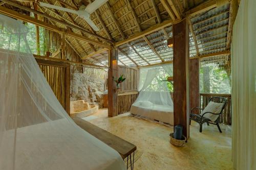 a bedroom with a bed and a tub in a room at El Valle Lodge in El Valle