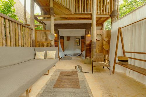 a living room with a couch and a dog laying on the floor at El Valle Lodge in El Valle