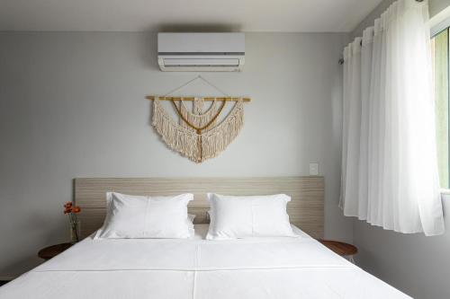 Postel nebo postele na pokoji v ubytování Pousada Casa da Praia Angra